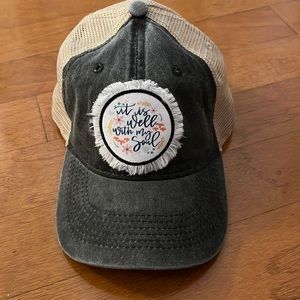 Trucker hat with black faded front and “It is Well With My Soul” patch